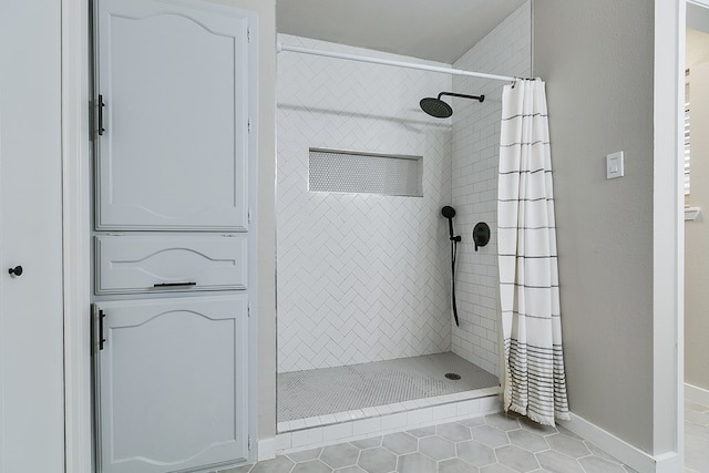 bathroom featuring walk in shower and tile patterned floors