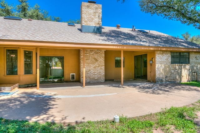 rear view of property featuring a patio