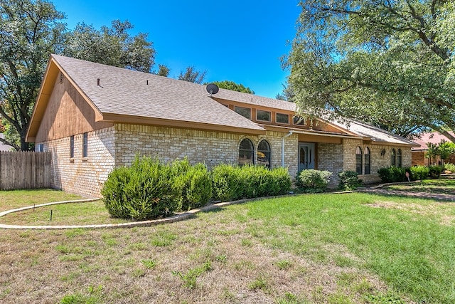 ranch-style house with a front yard