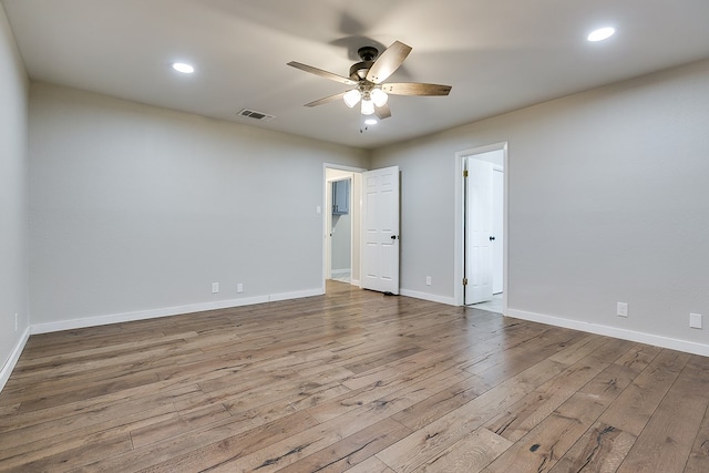 unfurnished room with hardwood / wood-style flooring and ceiling fan