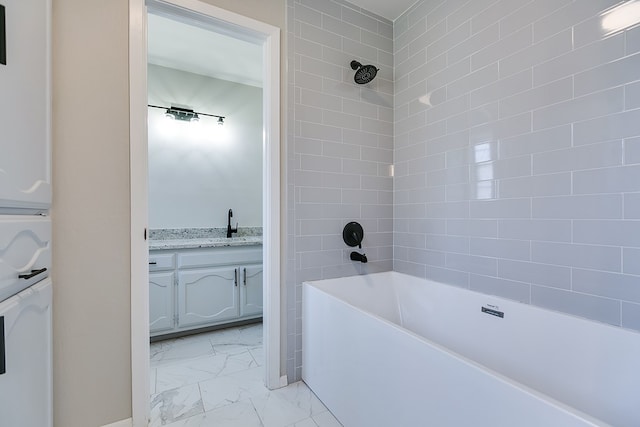 bathroom with vanity and tiled shower / bath combo