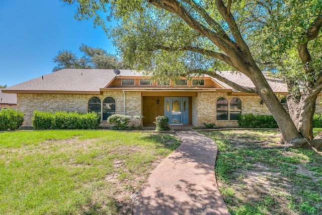 ranch-style house with a front yard