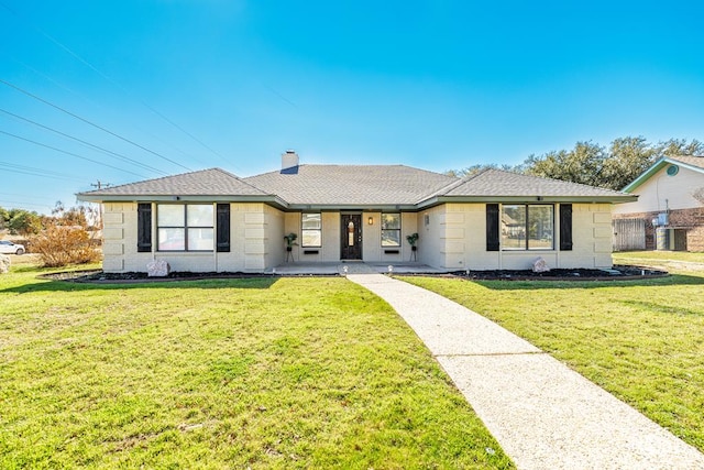 ranch-style house featuring a front lawn