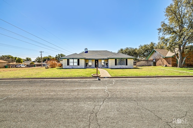 ranch-style house with a front lawn