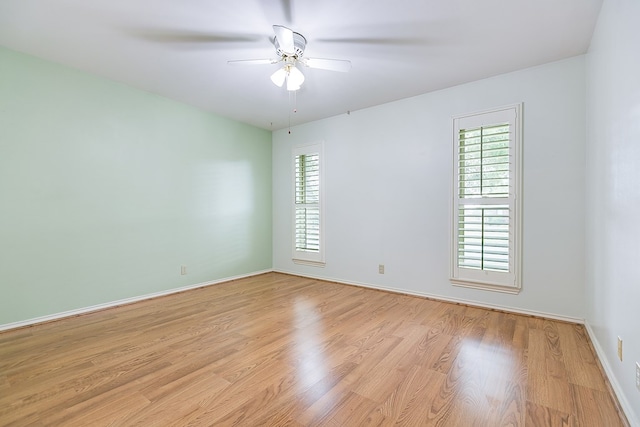 unfurnished room featuring light hardwood / wood-style floors and ceiling fan