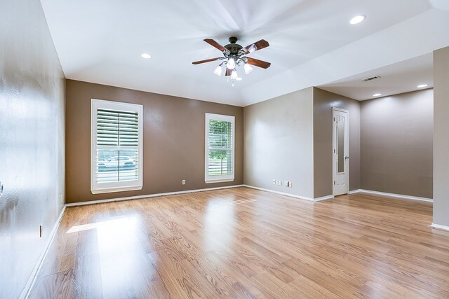 unfurnished room with ceiling fan and light hardwood / wood-style flooring