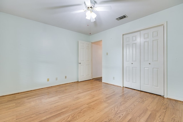 unfurnished bedroom with a closet, ceiling fan, and light hardwood / wood-style flooring