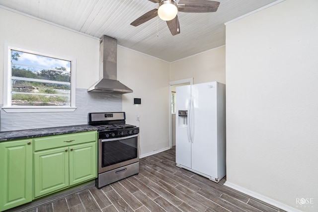 kitchen featuring tasteful backsplash, white fridge with ice dispenser, dark wood-type flooring, wall chimney range hood, and stainless steel gas range