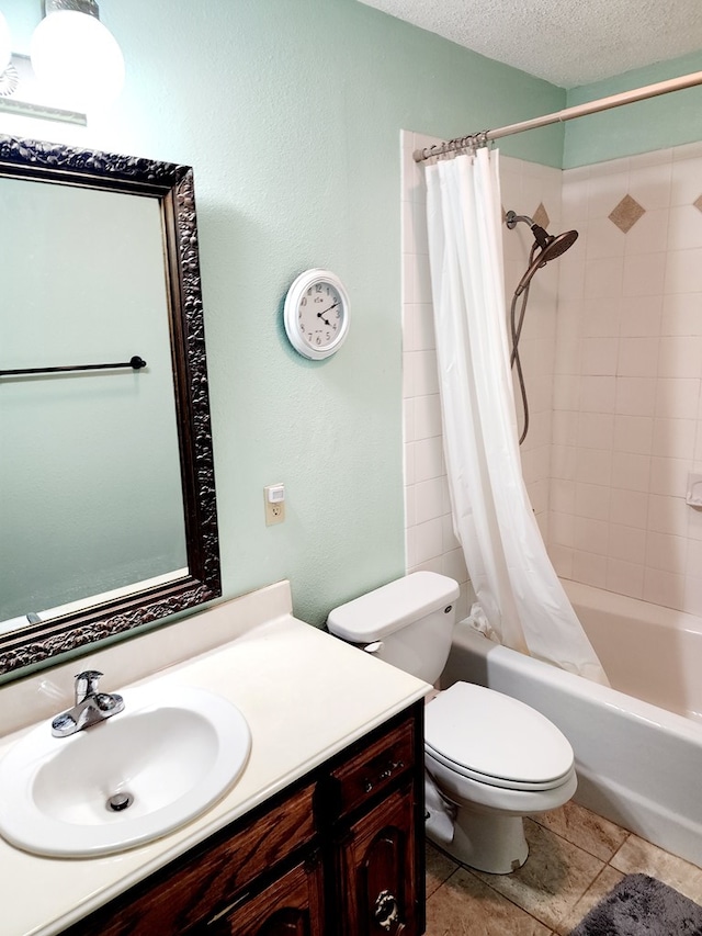 full bathroom with tile patterned floors, toilet, a textured ceiling, vanity, and shower / bath combo