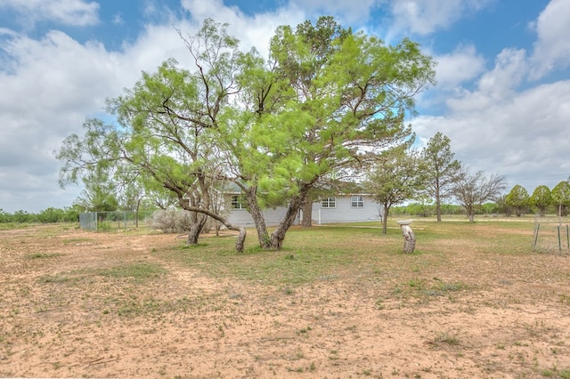 view of yard with a rural view