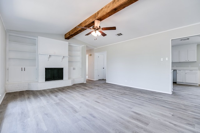 unfurnished living room with light hardwood / wood-style flooring, built in shelves, a fireplace, and lofted ceiling with beams