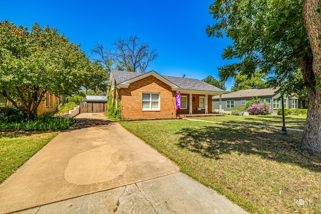 ranch-style home with a front yard