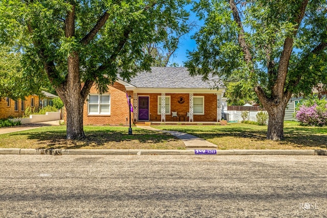 ranch-style home with a front lawn