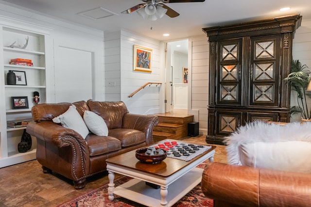 2611 Live Oak St, San Angelo, TX 76901 - living area with built in features, a ceiling fan, wood walls, and recessed lighting