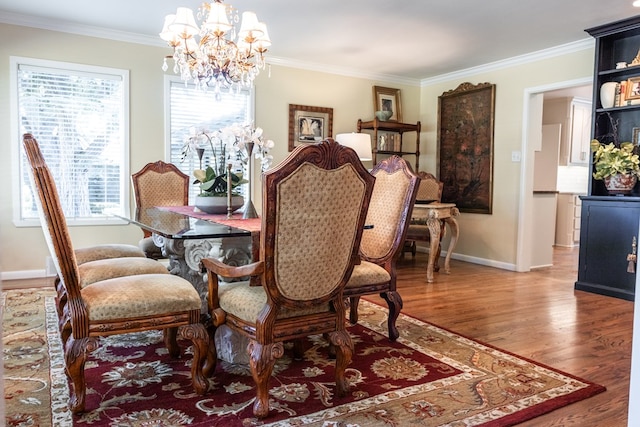 2611 Live Oak St, San Angelo, TX 76901 - dining room featuring a chandelier, wood finished floors, and ornamental molding