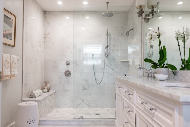 2611 Live Oak St, San Angelo, TX 76901 - bathroom with double vanity, a marble finish shower, and recessed lighting