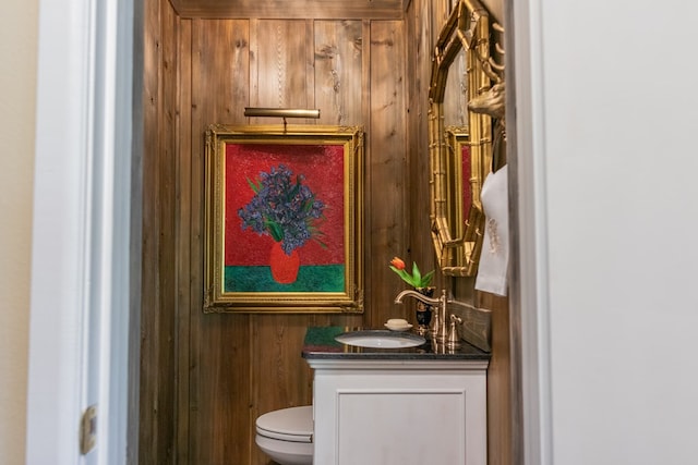 2611 Live Oak St, San Angelo, TX 76901 - half bath with vanity and wood walls