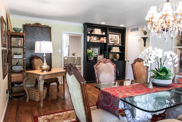 2611 Live Oak St, San Angelo, TX 76901 - dining space featuring a chandelier, ornamental molding, and wood finished floors