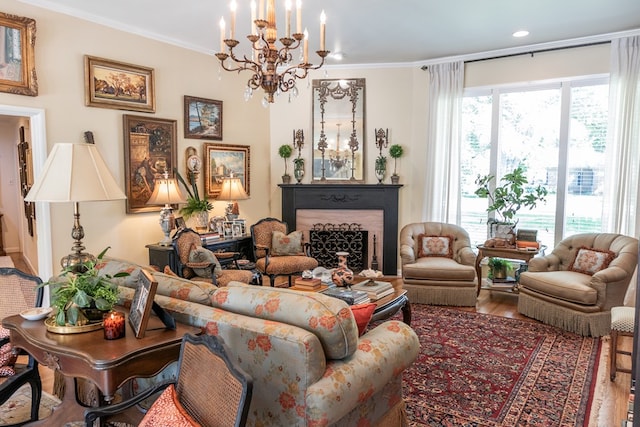 2611 Live Oak St, San Angelo, TX 76901 - living room featuring a chandelier, a fireplace, wood finished floors, ornamental molding, and recessed lighting
