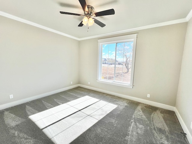 empty room featuring crown molding, carpet, and ceiling fan