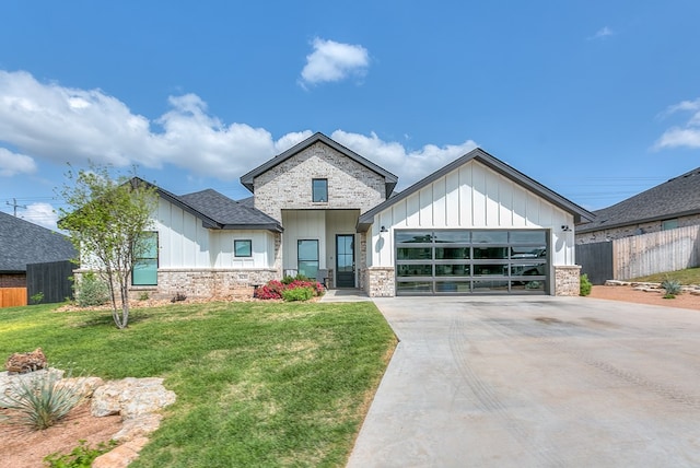 view of front of home with an attached garage, board and batten siding, fence, and concrete driveway