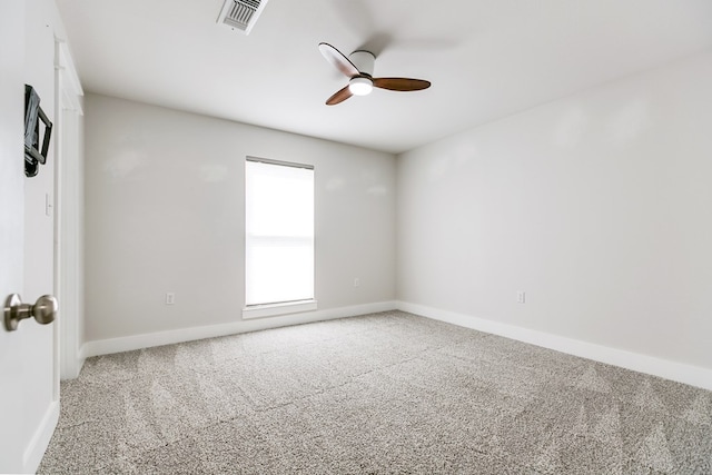 unfurnished room featuring baseboards, ceiling fan, carpet flooring, and visible vents
