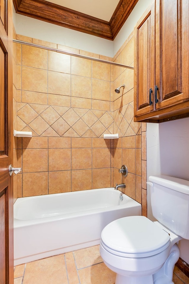 bathroom with tiled shower / bath, ornamental molding, toilet, and tile patterned flooring