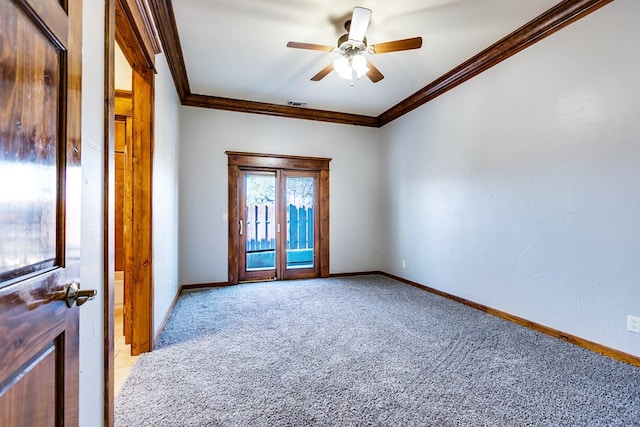 spare room featuring ornamental molding, light carpet, ceiling fan, and french doors