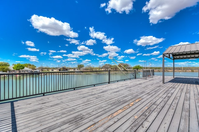 view of dock with a deck with water view