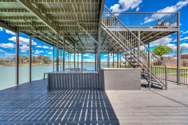 view of dock featuring a deck with water view