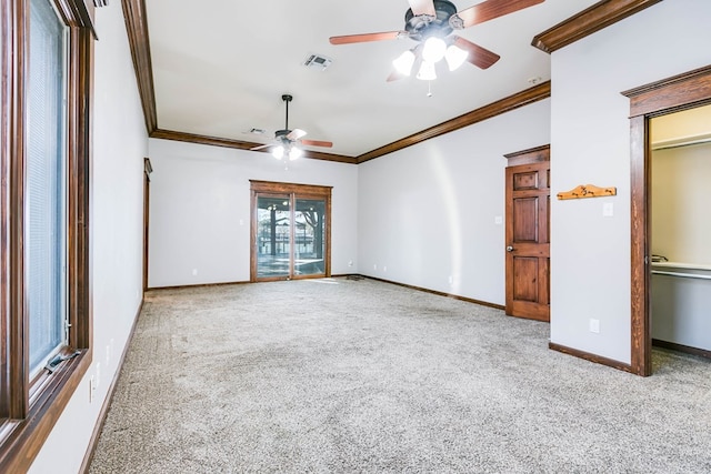 interior space with ornamental molding and ceiling fan