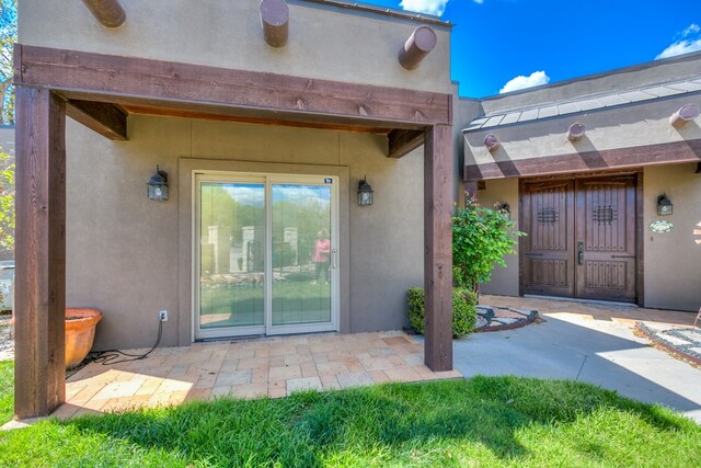 property entrance with a patio area