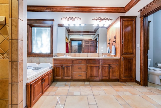 bathroom featuring vanity, ornamental molding, and toilet