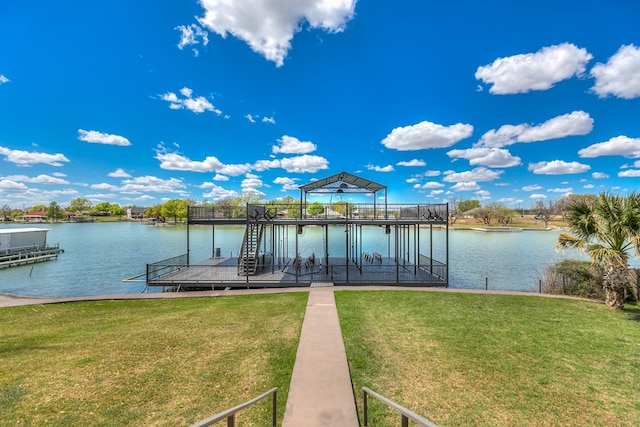 view of dock featuring a water view and a lawn