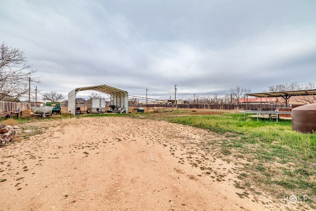 1335 Reece Rd, San Angelo, TX 76904 - view of yard featuring a detached carport and oil tank