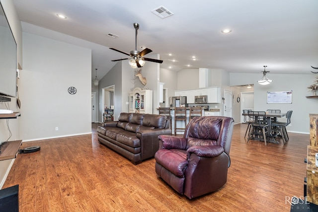 1335 Reece Rd, San Angelo, TX 76904 - living room with vaulted ceiling, ceiling fan, wood finished floors, baseboards, and recessed lighting
