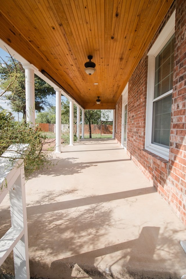 view of patio / terrace featuring fence