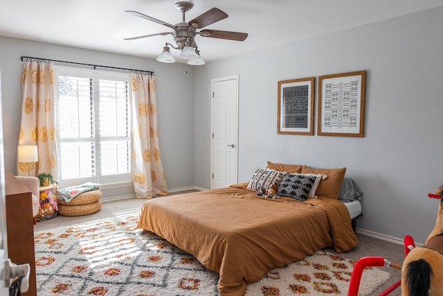 bedroom with ceiling fan and carpet floors