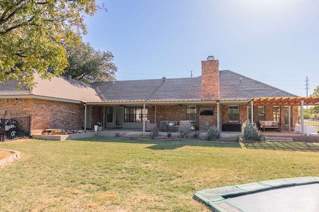 back of house featuring a yard, a pergola, and a patio area