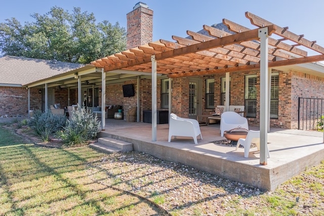 back of house featuring a pergola, a fire pit, and a patio