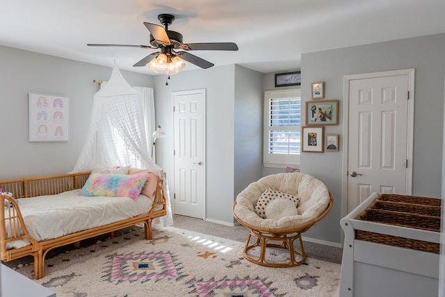 bedroom with ceiling fan and carpet