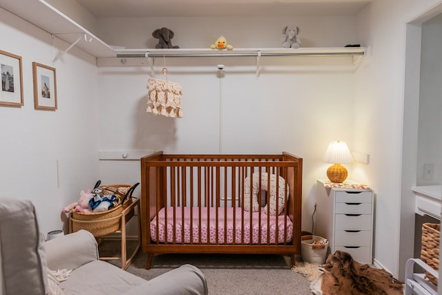 bedroom with carpet floors and a crib