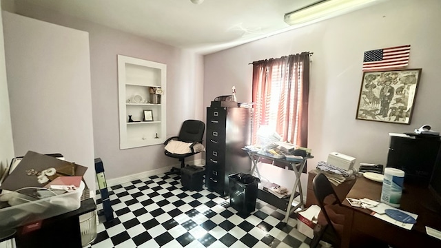 office space with baseboards, built in features, and tile patterned floors