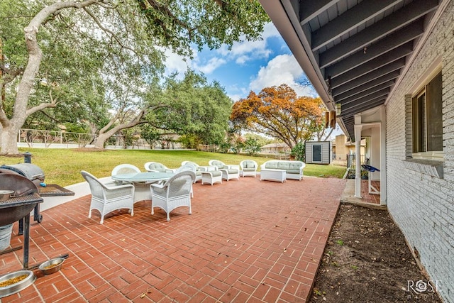 view of patio featuring a storage shed and an outdoor hangout area