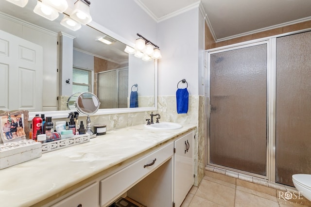 bathroom featuring tile patterned flooring, vanity, ornamental molding, walk in shower, and toilet