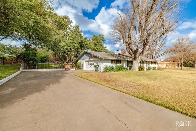 view of front of home with a garage and a front yard