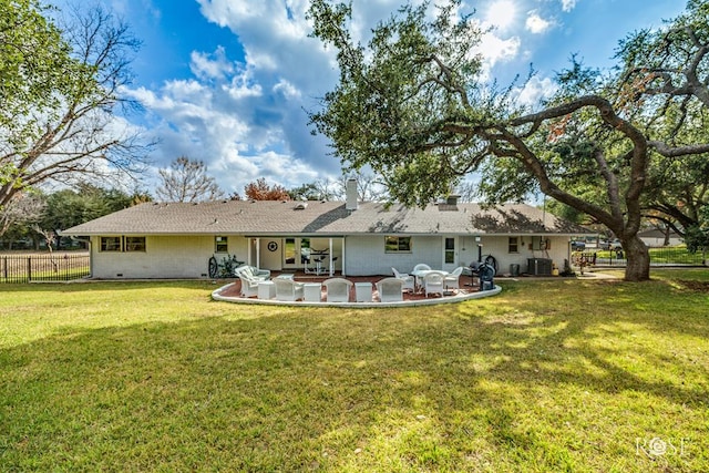 rear view of house featuring a patio, a yard, and cooling unit