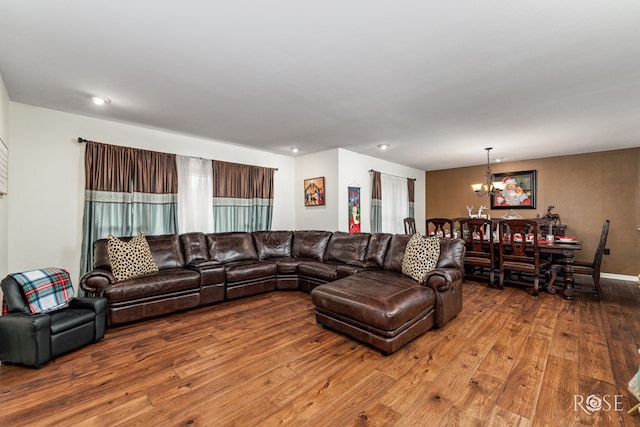 living room featuring a notable chandelier and wood-type flooring