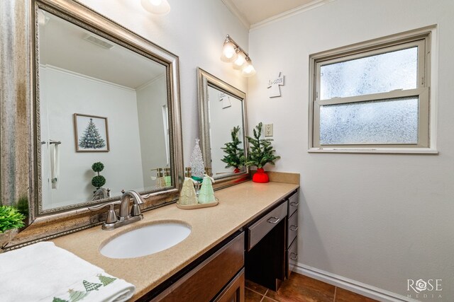 bathroom featuring crown molding, vanity, and tile patterned flooring