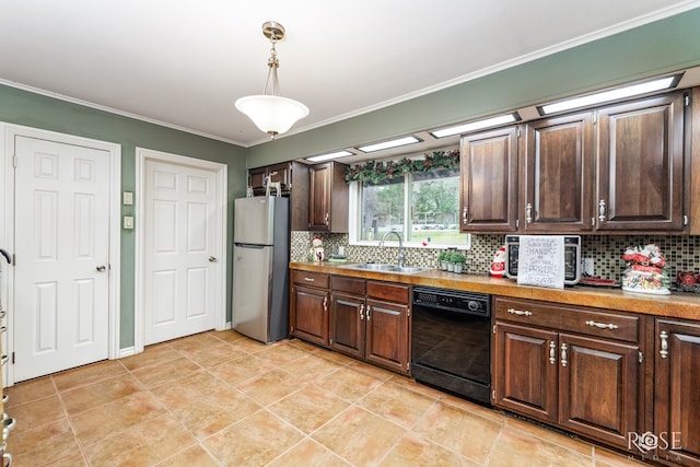 kitchen with sink, stainless steel refrigerator, hanging light fixtures, dark brown cabinets, and black dishwasher